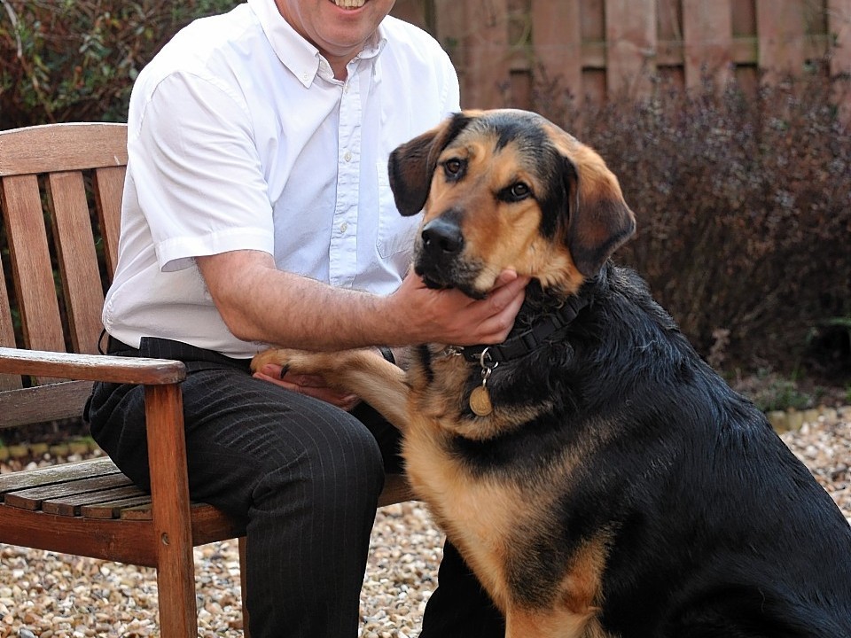 Aberdeenshire West MSP Dennis Robertson with his guide dog Mr Q.